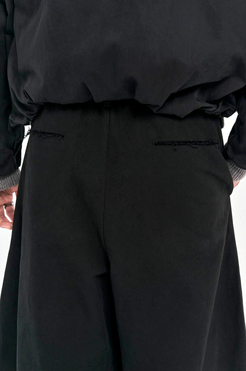 ALEE OASIS Wide-Leg Pleated Raw-Edge Trousers