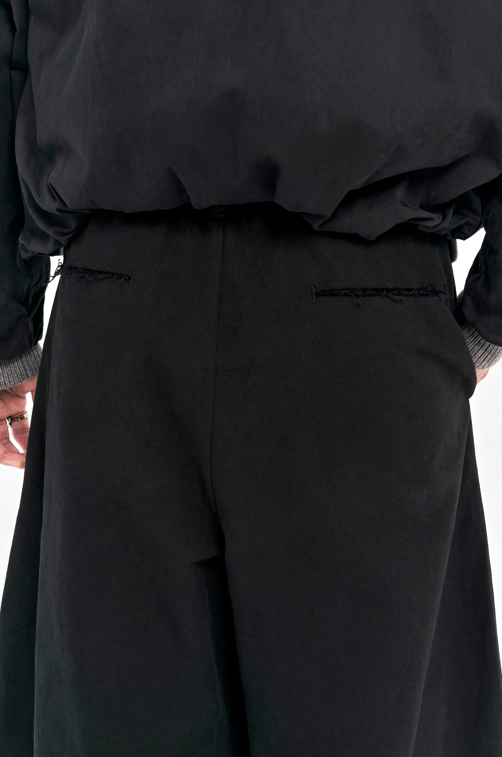 ALEE OASIS Wide-Leg Pleated Raw-Edge Trousers